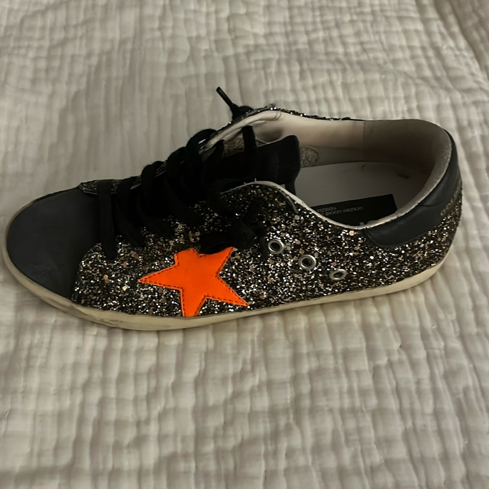 Sparkly black with orange star Golden Goose!! Worn a few times!!